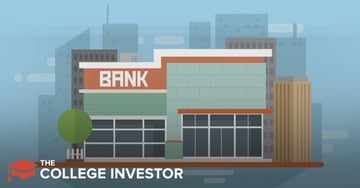 Best Credit Unions A digital illustration depicts a modern bank building in the foreground, featuring a two-story structure with distinct architectural elements. The left side of the building is predominantly orange-red with "BANK" written in prominent white capital letters, while the right side is a light teal color with textured blocks. Both sections have large windows reflecting the sky, and a small green tree with a white fence sits to the left. In the background, a light blue sky serves as a backdrop for a cityscape composed of various gray and brown buildings, suggesting an urban environment. The lower-left corner prominently displays the white text "THE COLLEGE INVESTOR", identifying the source of the content. This image visually represents the concept of traditional banks, providing a clear contrast for an article discussing credit unions as an alternative to banks, highlighting options like First Tech Federal Credit Union and Consumers Credit Union.