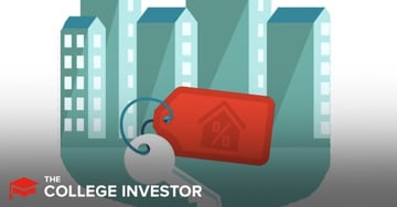 mortgage calculator A stylized illustration features a large, grey house key attached to a bright red rectangular keychain, prominently displaying a house icon with a percentage sign inside, symbolizing mortgage rates and home ownership. In the background, several tall, light blue and grey buildings with multiple windows are depicted, representing a cityscape or residential area. The overall image, titled "mortgage calculator," visually supports an article discussing how much house one can afford, mortgage affordability rules of thumb, and key financial considerations like debt-to-income ratio and credit score when buying a home. The bottom left corner includes a logo that reads "THE COLLEGE INVESTOR."