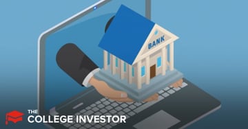 Truist Bank An isometric digital illustration depicts a human hand, emerging from the screen of a silver laptop, presenting a miniature bank building. The hand has light skin and is clad in a dark suit sleeve with a white cuff, holding the small, classic-style bank with a blue roof, white columns, and the word "BANK" clearly visible above the entrance. The laptop itself is open with its keyboard and screen visible against a solid blue background. This visual metaphor effectively represents the discussion in the article about Truist Bank, formed from the merger of BB&T and SunTrust, emphasizing the accessibility of banking services, including checking and savings accounts, through digital platforms, even as the new financial company expands its physical branches and ATM access for approximately 10 million households.