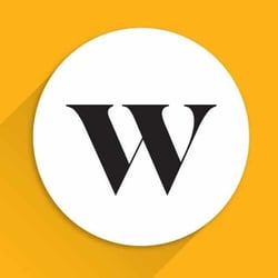 wealthsimple review A prominent, centered image features a bold, capitalized letter "W" in a classic serif font, rendered in black. This "W" is enclosed within a crisp white circular background, creating a clean and striking emblem. The white circle itself is set against a vibrant, solid yellow background, which provides a strong contrast and makes the central design pop. A subtle yet noticeable shadow extends from the bottom and right side of the white circle, giving the entire graphic a slight three-dimensional effect and depth. This visual representation serves as the iconic logo for Wealthsimple, a popular automated investing platform and robo-advisor mentioned in the accompanying article, which caters to Canadian investors with services like stock and crypto trading, and managed portfolios.