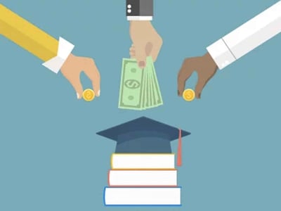 This illustrative image depicts three sets of hands, each representing different parties involved in student loan refinancing. A central hand from above, wearing a suit cuff, holds and disperses several US dollar bills, symbolizing a lender or financial institution providing new funds. Two other hands, one with a yellow sleeve and another with a white sleeve, are shown pushing gold coins towards the center, representing individuals making payments or investments. Below these hands, a stack of three books with a graduation cap resting on top clearly signifies education and student loans. The overall scene visually communicates the process of student loan refinancing, where a new loan replaces existing debt, as discussed in the article "Best Student Loan Refinance Companies" by The College Investor, whose logo is prominently displayed in the bottom left corner.
