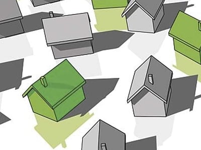 An overhead, graphic illustration displays numerous simplified house icons scattered across a light-colored surface, casting soft shadows. Most of the houses are rendered in a neutral gray tone with black outlines, representing various real estate investments. However, several houses are distinctly colored in a vibrant green, highlighting the specific real estate opportunities discussed in the accompanying article, such as private REITs like Streitwise. This visual effectively conveys the concept of diversifying an investment portfolio with real estate, emphasizing the neglect of this asset class by many investors. In the bottom left corner, "THE COLLEGE INVESTOR" logo is prominently featured in white text, reinforcing the source of the financial advice and guidance on topics like asset allocation and passive income through real estate investment trusts.