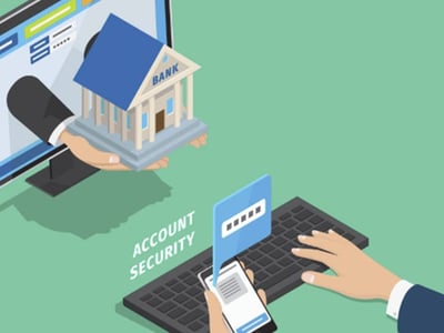 A digital illustration depicts the concept of online banking security, directly relevant to a Vio Bank review. On the left, a hand extends from a computer monitor, holding a miniature, light blue bank building with "BANK" clearly written on its facade, symbolizing accessing banking services online. On the right, hands type on a black keyboard, while a smartphone displaying a lock icon and text message is positioned in front of it. Above the phone, a blue box with a password field and a visible asterisk pattern signifies secure login, and the words "ACCOUNT SECURITY" float nearby. The green background highlights the digital and financial theme, underscoring the article's focus on secure, high-yield savings accounts and whether Vio Bank is a worthwhile option for consumers seeking competitive rates.