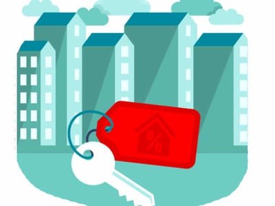 A stylized illustration features a large, grey house key attached to a bright red rectangular keychain, prominently displaying a house icon with a percentage sign inside, symbolizing mortgage rates and home ownership. In the background, several tall, light blue and grey buildings with multiple windows are depicted, representing a cityscape or residential area. The overall image, titled "mortgage calculator," visually supports an article discussing how much house one can afford, mortgage affordability rules of thumb, and key financial considerations like debt-to-income ratio and credit score when buying a home. The bottom left corner includes a logo that reads "THE COLLEGE INVESTOR."
