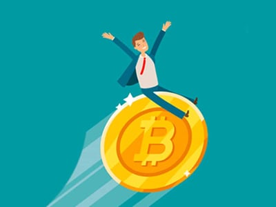 A cheerful, light-skinned man with brown hair, dressed in a blue suit jacket, white shirt, and red tie, celebrates excitedly with his arms outstretched, as he balances precariously on the edge of a large, golden Bitcoin coin. The coin, detailed with a prominent 'B' symbol and a circular pattern, appears to be rolling forward and upward, leaving a subtle white streak behind it, signifying momentum. The background is a solid, teal-blue gradient, darker at the top and lighter towards the bottom. In the lower-left corner, "THE COLLEGE INVESTOR" is displayed in white, sans-serif font. This image visually represents the excitement and potential rewards of earning free crypto and securing crypto bonus offers, aligning with the article's focus on the best crypto bonuses available.