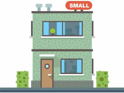 A vibrant cartoon illustration depicts a small, two-story green building with a prominent orange sign on the roof that reads "SMALL," signifying a small business. The building has a modern, minimalist design with several windows showcasing a simple interior, and a dark brown front door with a circular window. Two small green bushes with abstract yellow spots flank the building, sitting on a dark grey ground. In the bottom left corner, "THE COLLEGE INVESTOR" is written in bold white letters, reinforcing the article's focus on peer-to-peer lending and investment opportunities for individuals in small businesses like the one shown, particularly through platforms like SMBx.