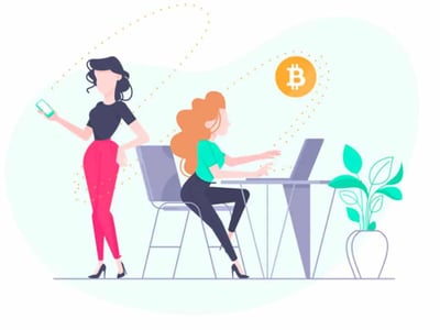 A digital illustration shows two women engaged in financial activities related to order routing for stocks and crypto. On the left, a woman with dark hair, wearing a black top and red pants, stands while holding a smartphone with a green screen, representing mobile trading or checking market prices. On the right, a woman with curly reddish-orange hair, dressed in a teal top and dark pants, sits at a desk working on a laptop, symbolizing more in-depth trading or analysis. A potted plant sits on the desk, adding a touch of a modern office environment. Above them, dotted lines curve and connect towards a prominent orange Bitcoin symbol, illustrating the concept of order routing and how trades for crypto tokens and stocks navigate through various channels to reach exchanges or market makers, ultimately leading to execution. The image visually supports the article's explanation of what order routing is, its importance for successful trading, and how platforms like TradeStation facilitate efficient routing for both stock and crypto investors.