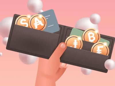 A close-up image displays a person's hand holding several credit cards, subtly emphasizing the concept of financial transactions. The cards are dark in color, suggesting a sleek, modern design. Above the cards, bold red and blue text announces "BEST CRYPTO REWARDS CREDIT CARDS," directly linking the visual to the article's core topic. The background is a soft, light red hue, providing a minimalist yet engaging contrast to the darker cards. This image effectively illustrates the article's focus on the growing trend of crypto rewards credit cards, which allow users to earn cryptocurrency through everyday spending. It visually reinforces the idea of investing in cryptocurrencies and leveraging credit cards for unique financial benefits.