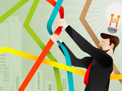 This vibrant and conceptual image depicts a businessman in a dark suit and red tie, actively engaging with multiple upward-trending lines in various colors, including red, blue, green, and orange, suggesting the dynamic and often complex nature of stock market trends and investment research. A bright, glowing lightbulb with an illuminated filament is prominently displayed above his head, symbolizing new ideas, innovative strategies, and the critical insights gained from thorough investment research. The background features a subtle city skyline, hinting at the financial world, with "The College Investor" logo in the bottom left corner, reinforcing the article's focus on helping investors. This visual metaphor perfectly illustrates the challenge and reward of finding "winning investments" and "hot stock ideas" using platforms like Seeking Alpha Premium, where research and analysis lead to valuable investment ideas and opportunities.