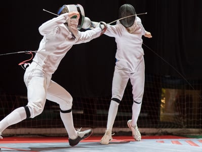 Two College Students Fencing Athletes