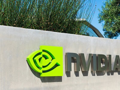 Outdoor corporate sign featuring the bright green Nvidia logo and metallic text. This illustrates major employers offering student loan repayment assistance (SLRA) benefits to help staff repay debt. | Source: The College Investor