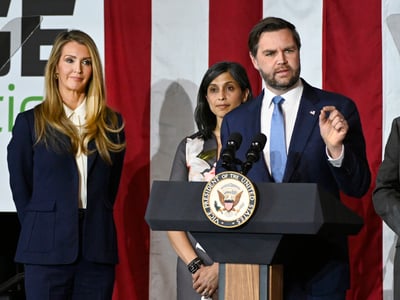 Vice President JD Vance, right, speaks at a rally about "America's industrial resurgence," as he is flanked by Administrator of the Small Business Administration Kelly Loeffler, far left, and his wife, Usha Vance, Friday, March 14, 2025, at Vantage Plastics in Bay City, Mich. (AP Photo/Jose Juarez)