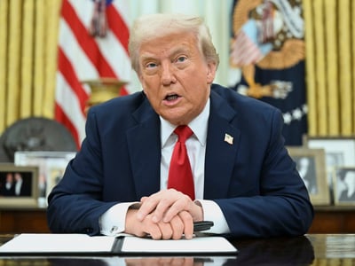 President Donald Trump speaks to reporters before signing an executive order in the Oval Office of the White House in Washington, Monday, March 31, 2025. (Pool via AP)