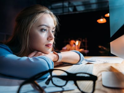 Tired student loan borrower waiting on SAVE | Source: DmitryPoch