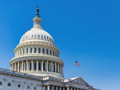 The United States Capitol building with American flag | Source: The College Investor