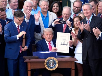 US President Donald Trump signs "Big Beautiful Bill" during a Fourth of July celebration event on the South Lawn at the White House in Washington on July 4, 2025. Photo by Yuri Gripas/Abaca/Sipa USA(Sipa via AP Images)