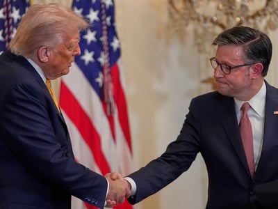 President Donald Trump shakes hands with House Speaker Mike Johnson of La., during a reception for Republican members of Congress in the East Room of the White House, Tuesday, July 22, 2025, in Washington. (AP Photo/Julia Demaree Nikhinson)