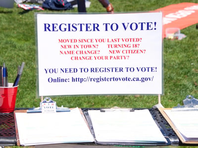 San Francisco, CA - Register to vote table set up at the "Families Belong Together" protest at City Hall, protesting Trump's "Zero Tolerance" policy and the separation of more that 2,000 children | Photo by Sheilaf2002