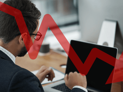 Office worker overlaid with declining unemployment | Source: The College Investor