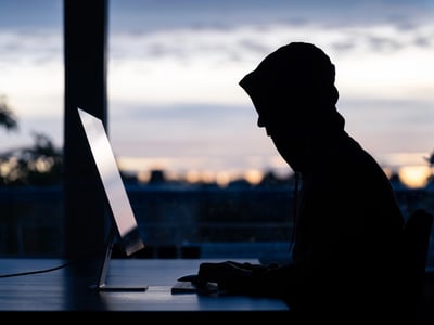 Hacker committing online scams | Source: The College Investor