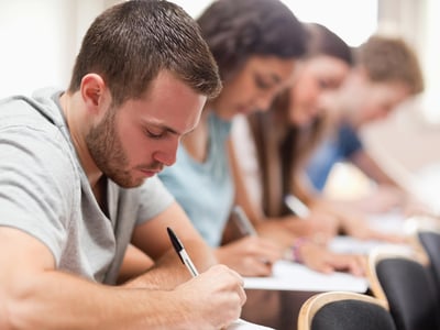 Students Taking The CLT Exam | Source: The College Investor