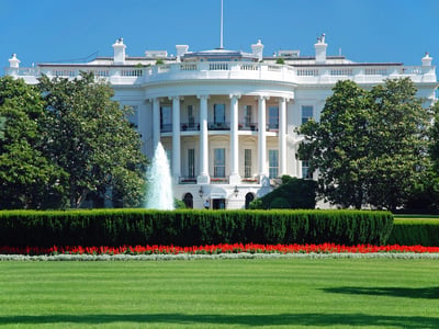 Sunny daytime view of the White House South Portico with the fountain and red flowers. This symbolizes the federal policy updates in this week's news, specifically the proposed "Trump Accounts" for newborn college savings. Source: The College Investor