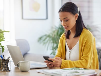 Phone, contact and woman in home typing email for online university application information.