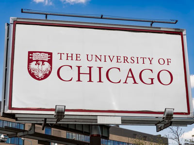 Advertisement billboard displaying logo of The University of Chicago, a private research university in Chicago, Illinois
