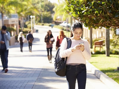 Female student walking on University Campus