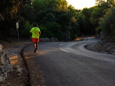 Young man running down the road without limits, representing the upcoming graduate loan limits. Source: The College Investor