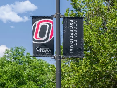 OMAHA, NE, USA - College flag on the campus of the University of Nebraska Omaha.