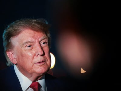 U.S. President Donald Trump looks on as he speaks to members of the media after disembarking Air Force One at Joint Base Andrews, Maryland, U.S., August 11, 2026. REUTERS/Kylie Cooper