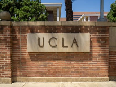 UCLA sign on brick wall
