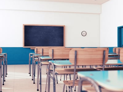 Empty school classroom with desks and chairs