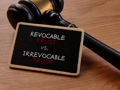 Revocable vs. Irrevocable Trust with Gavel on Wooden Table