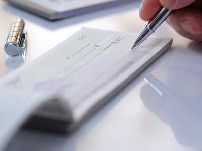Prepare writing a check in office
