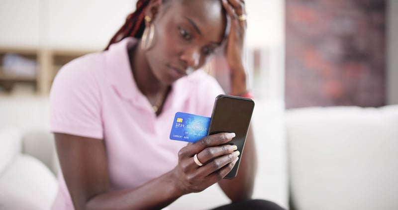 Too Many Credit Cards. African American Woman Credit scores and credit card debt | Source: The College Investor