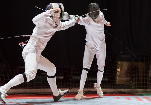 Two College Students Fencing Athletes