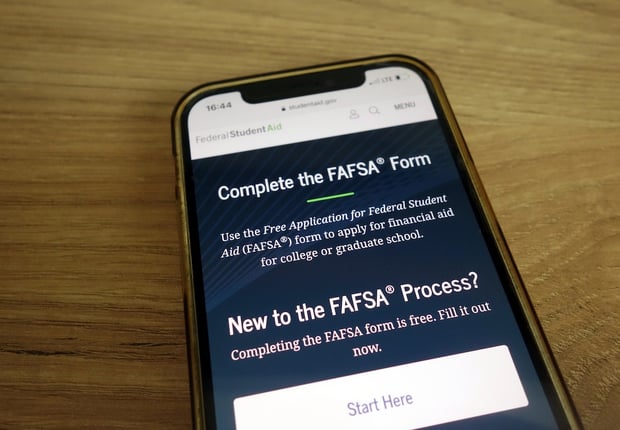 studentaid.gov website about FAFSA form displayed on mobile phone