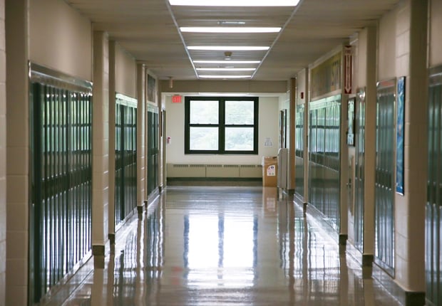 High school hallway representing high school guidance counselor push to college.
