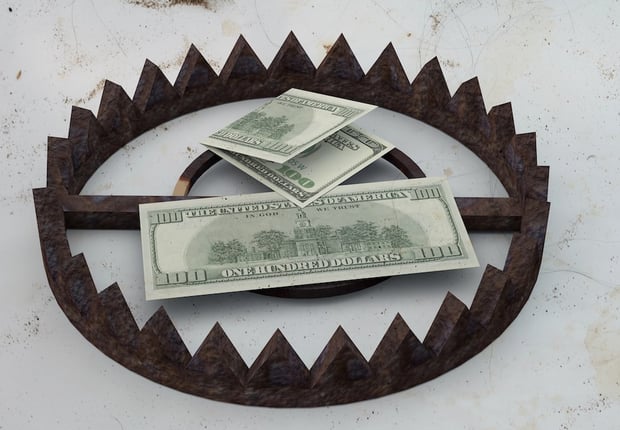 Financial Trap with Dollar Bills in a Bear Trap