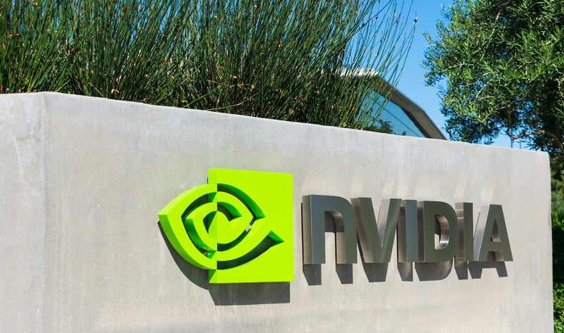 Nvidia Headquaters Outdoor corporate sign featuring the bright green Nvidia logo and metallic text. This illustrates major employers offering student loan repayment assistance (SLRA) benefits to help staff repay debt. | Source: The College Investor