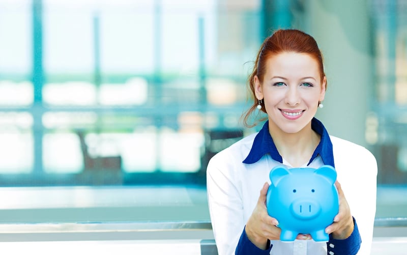 Business woman holding piggy bank 529 plan rule changes