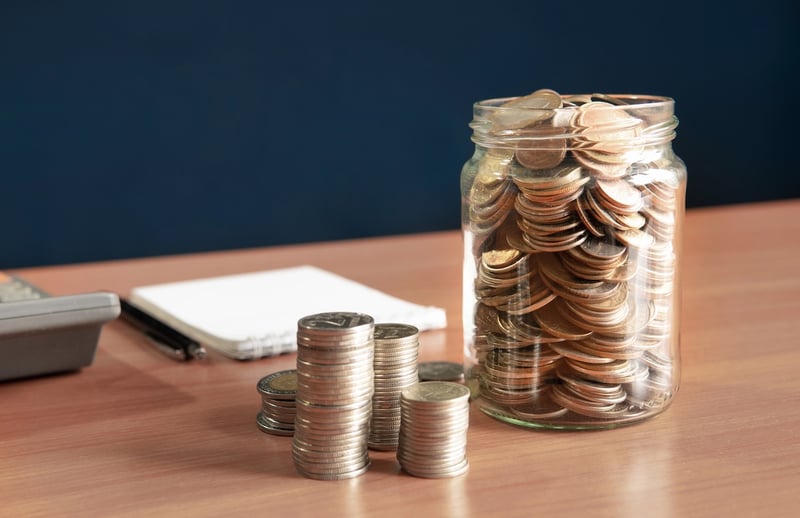 Coins Stored In A Jar Coins stored in a jar, representing the interest earned on your savings account. Source: The College Investor