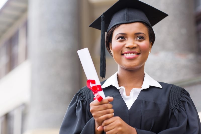 beautiful young african american graduate holding diploma. Source: The College Investor