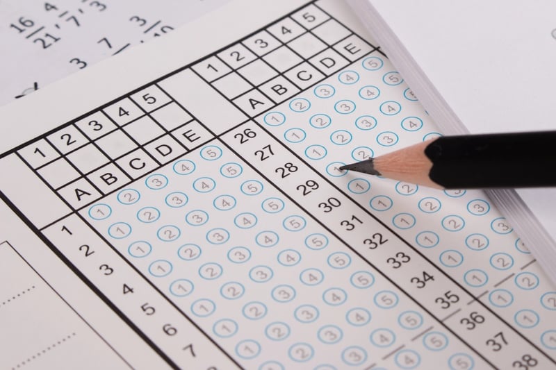 Standard test form or answer sheet. Answer sheet focus on pencil. Bubble anser sheet with blank answer. School exam answer sheet and pen.