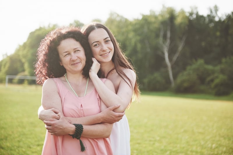 Mom and teenage daughter going to college