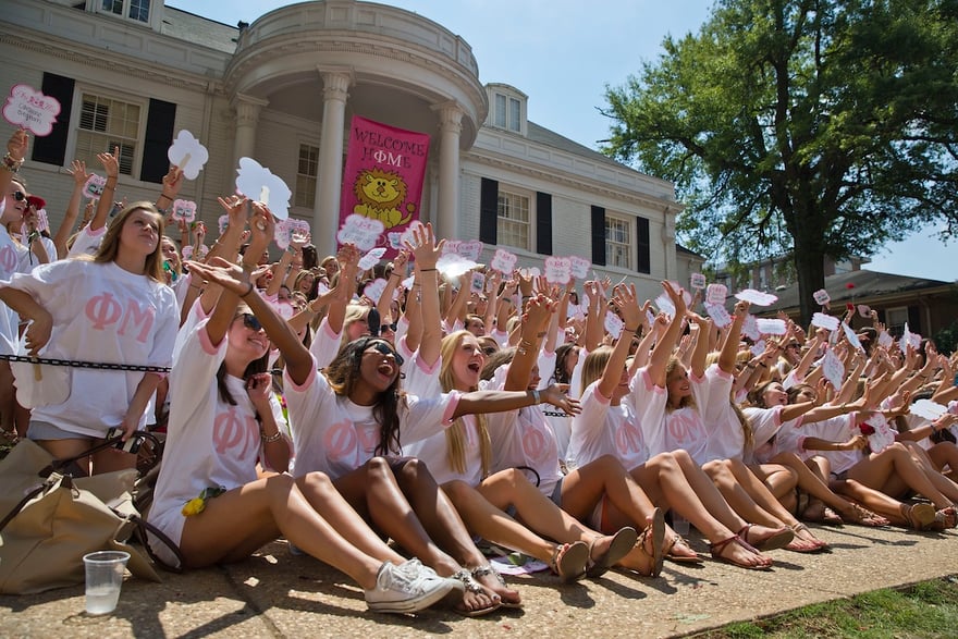The University of Alabama Phi Mu's newest sorority members, in front, gather at sorority house for a photograph during Bid Day on Saturday, Aug. 16, 2014, in Tuscaloosa, Ala. The university became embroiled in controversy in 2013 after the student newspaper reported some white sororities had rejected blacks as new members because of race. At the end of 2014 sorority recruitment, black women made up 1 percent of new members. (AP Photo/Brynn Anderson)