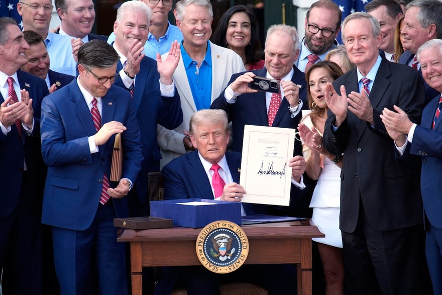 US President Donald Trump signs "Big Beautiful Bill" during a Fourth of July celebration event on the South Lawn at the White House in Washington on July 4, 2025. Photo by Yuri Gripas/Abaca/Sipa USA(Sipa via AP Images)