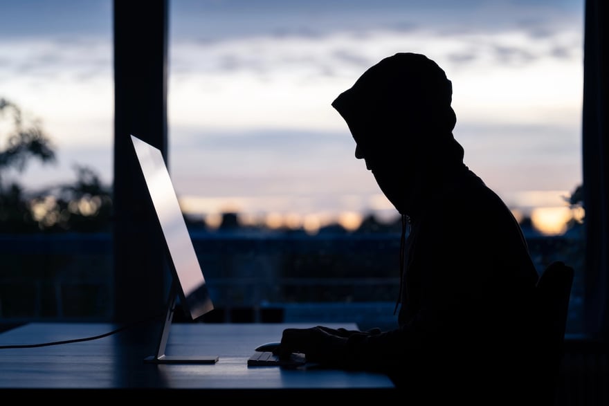Hacker committing online scams | Source: The College Investor